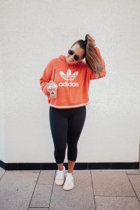 Ashley Zeal from Two Peas in a Prada shares the best activewear on sale at Nordstrom. She is wearing Nike, Adidas and Zella.