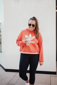 Ashley Zeal from Two Peas in a Prada shares the best activewear on sale at Nordstrom. She is wearing Nike, Adidas and Zella.