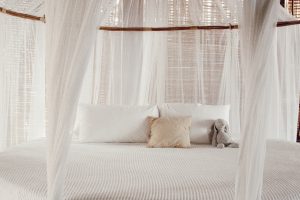Ashley Zeal from Two Peas in a Prada shares her Tulum Travel Guide. Round bed at Azulik.